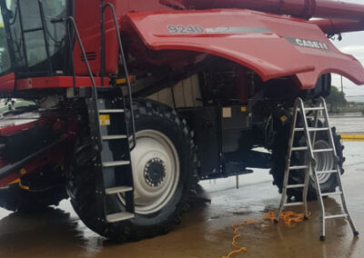 Detailing the motor and distribution equipment on a combine harvester in Lipson, Eyre Peninsula